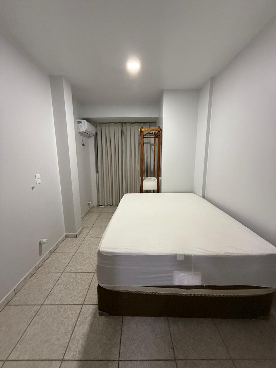 Interior de quarto standard da Pousada Grando